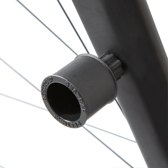 A black Restrap Light Mount attached to a bicycle fork, with a light on top.