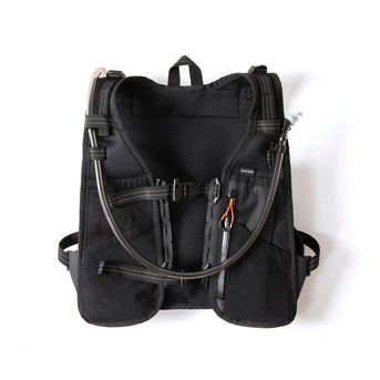 Rear of the Restrap race hydration vest on a white background, showing the reflective label and zip compartment