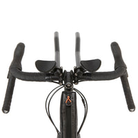 restrap race top tube bag mounted to a titanium bike, shown from a behind the handlebars perspective