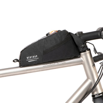 A black Race Top Tube Bag attached to the top tube of a bicycle, featuring a YKK aquaguard zip and reflective detailing.