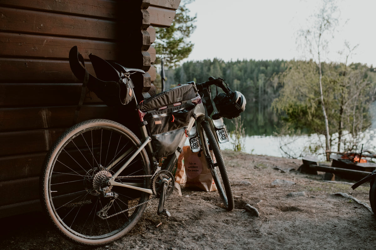 gravel bike with restrap bikepacking bags attached in a countryside setting
