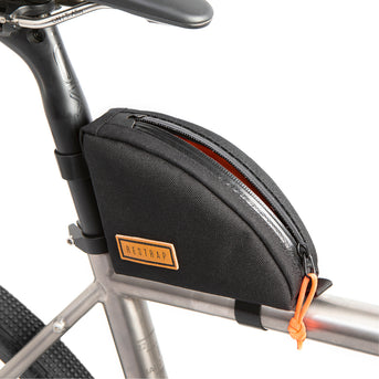A black Rear Top Tube Bag attached to the top tube of a bicycle just below the seat, featuring a simple zip closure and a small label with the brand name.
