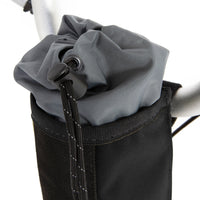 A closeup of the restrap City Stem Bag with a capacity of 1 litre, attached to the handlebars of a folding bicycle.