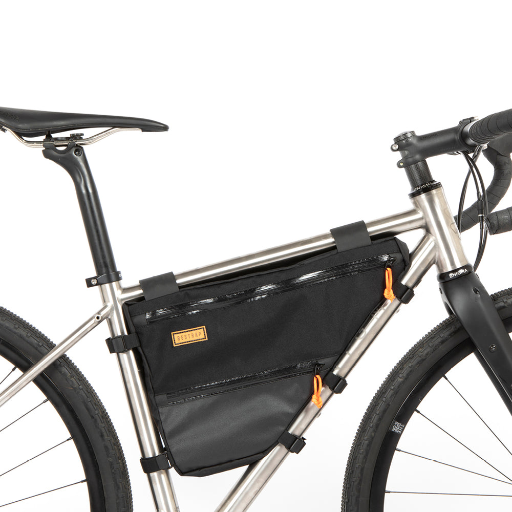A small black full frame bag attached to the down tube of a bicycle, featuring adjustable straps, two zips and a Restrap label.
