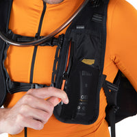 Person wearing an hydration vest with a black pouch and visible branding.