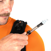 Person clipping a hydration hose onto a vest strap