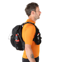 Man wearing a black backpack with a Coca-Cola bottle on a white background