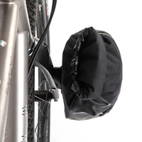 Restrap Switch Pannier attached to the fork of a bike on a white background