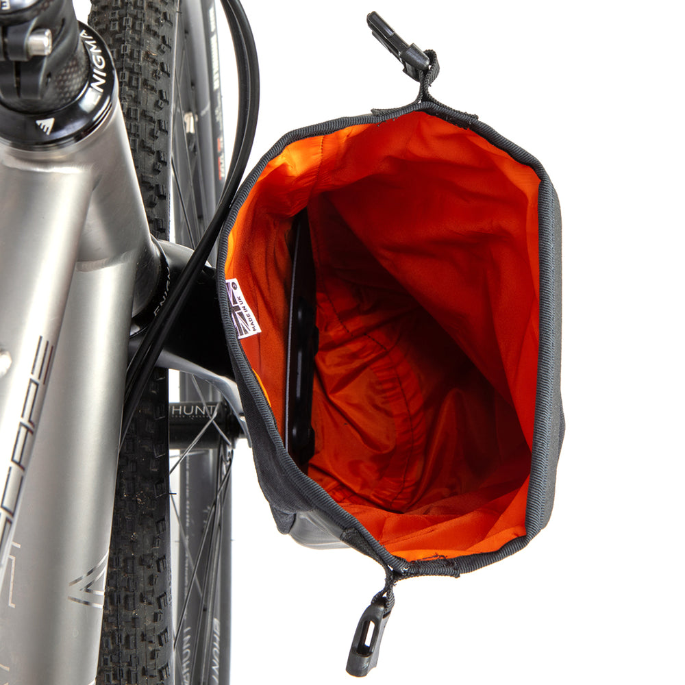Inside of a Restrap Switch Pannier attached to the fork of a bike on a white background