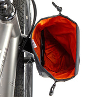 Inside of a Restrap Switch Pannier attached to the fork of a bike on a white background