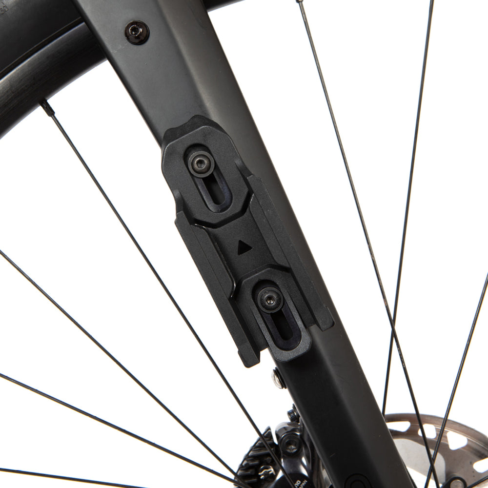 Close-up of a restrap multi mount fitting on a fork on a white background
