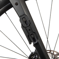 Close-up of a restrap multi mount fitting on a fork on a white background