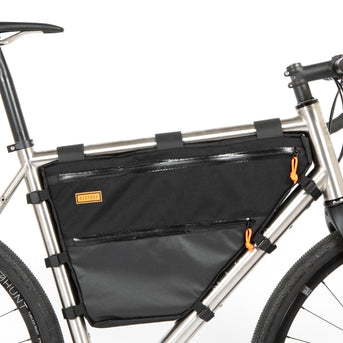 A large black full frame bag attached to a bicycle frame, with adjustable straps and a Restrap label visible.