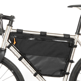 A large black full frame bag attached to a bicycle frame, with adjustable straps and a Restrap label visible.